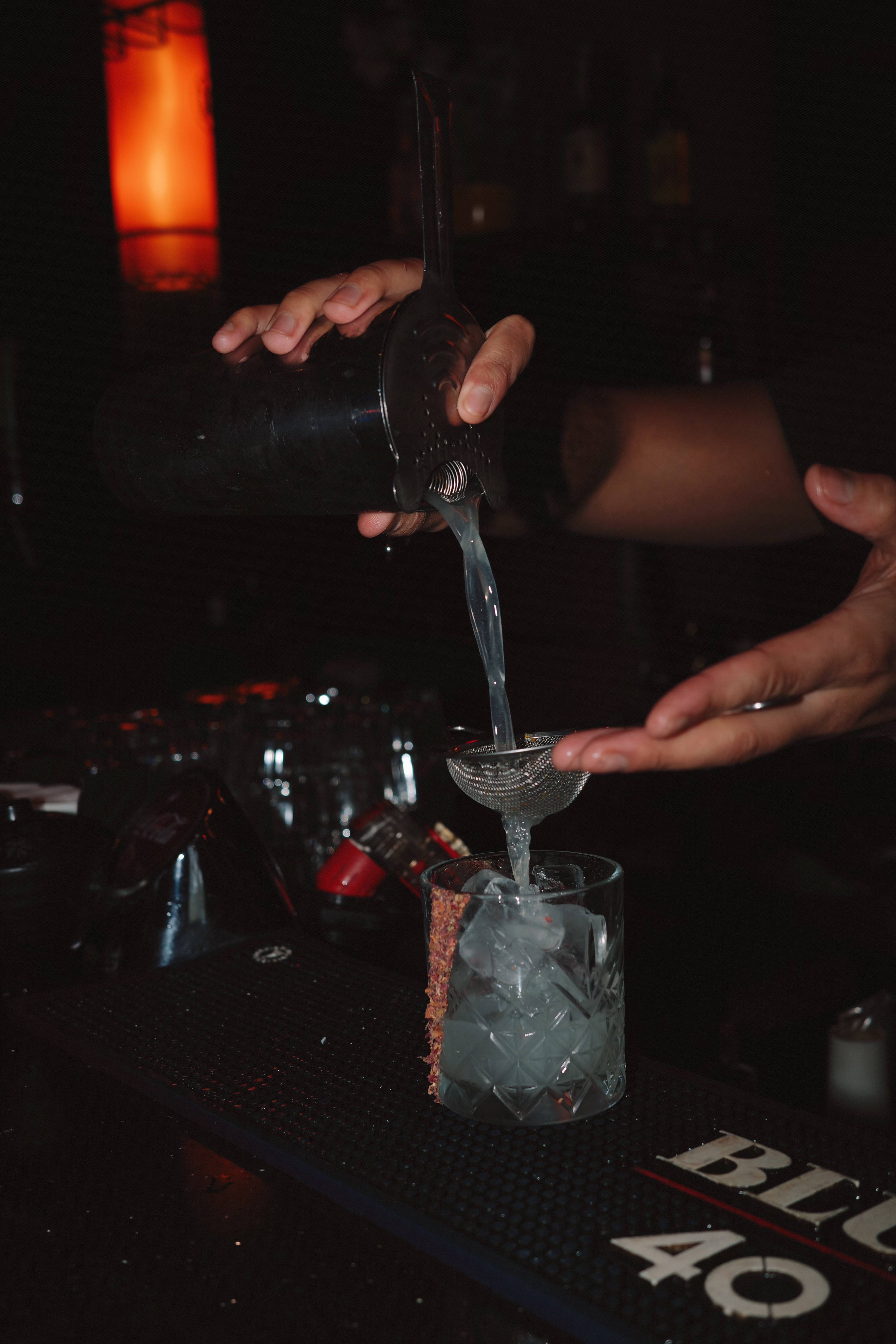 Bartender preparing cocktail with precision