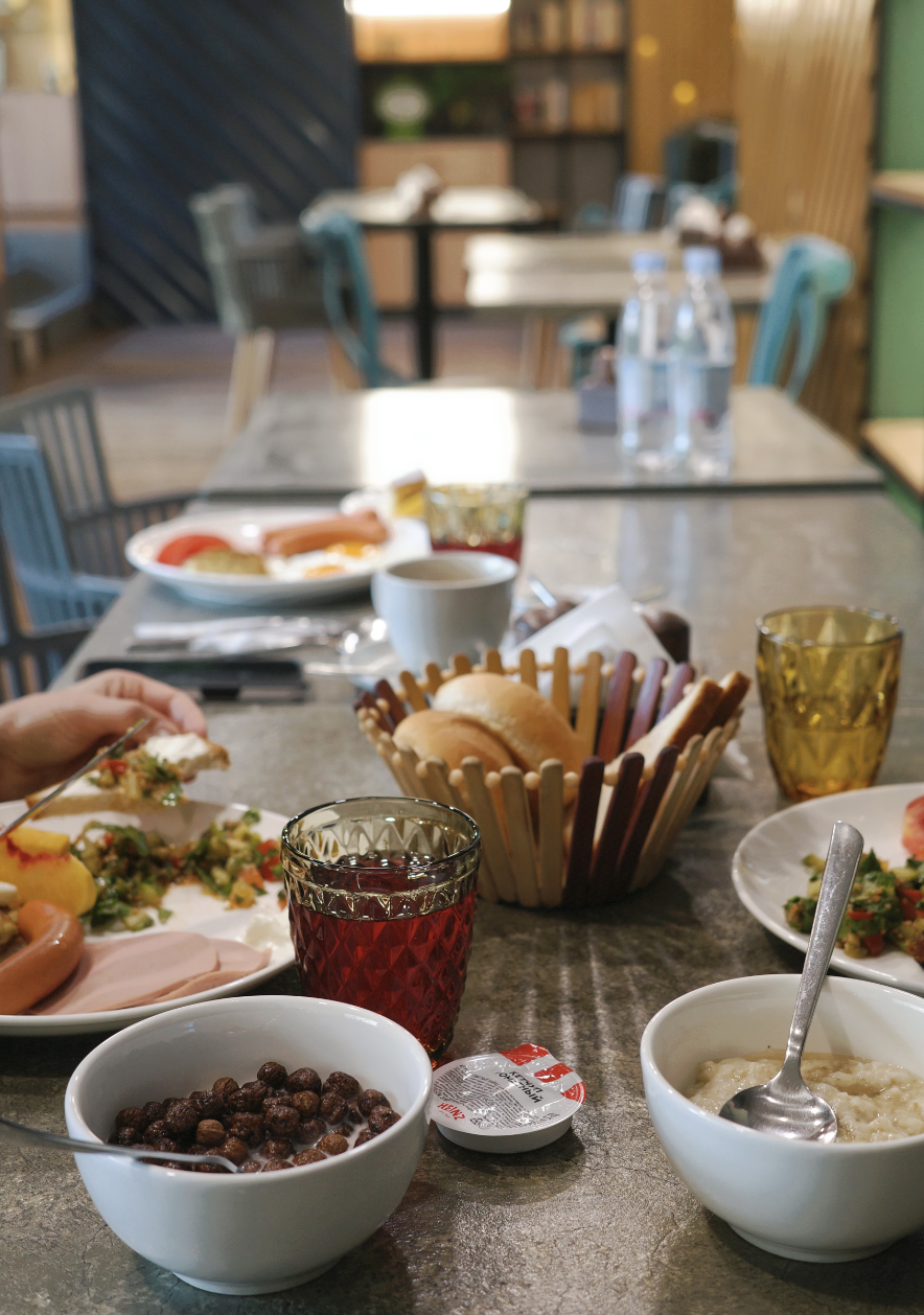 Cartez Brunch table spread with colorful glassware and fresh dishes