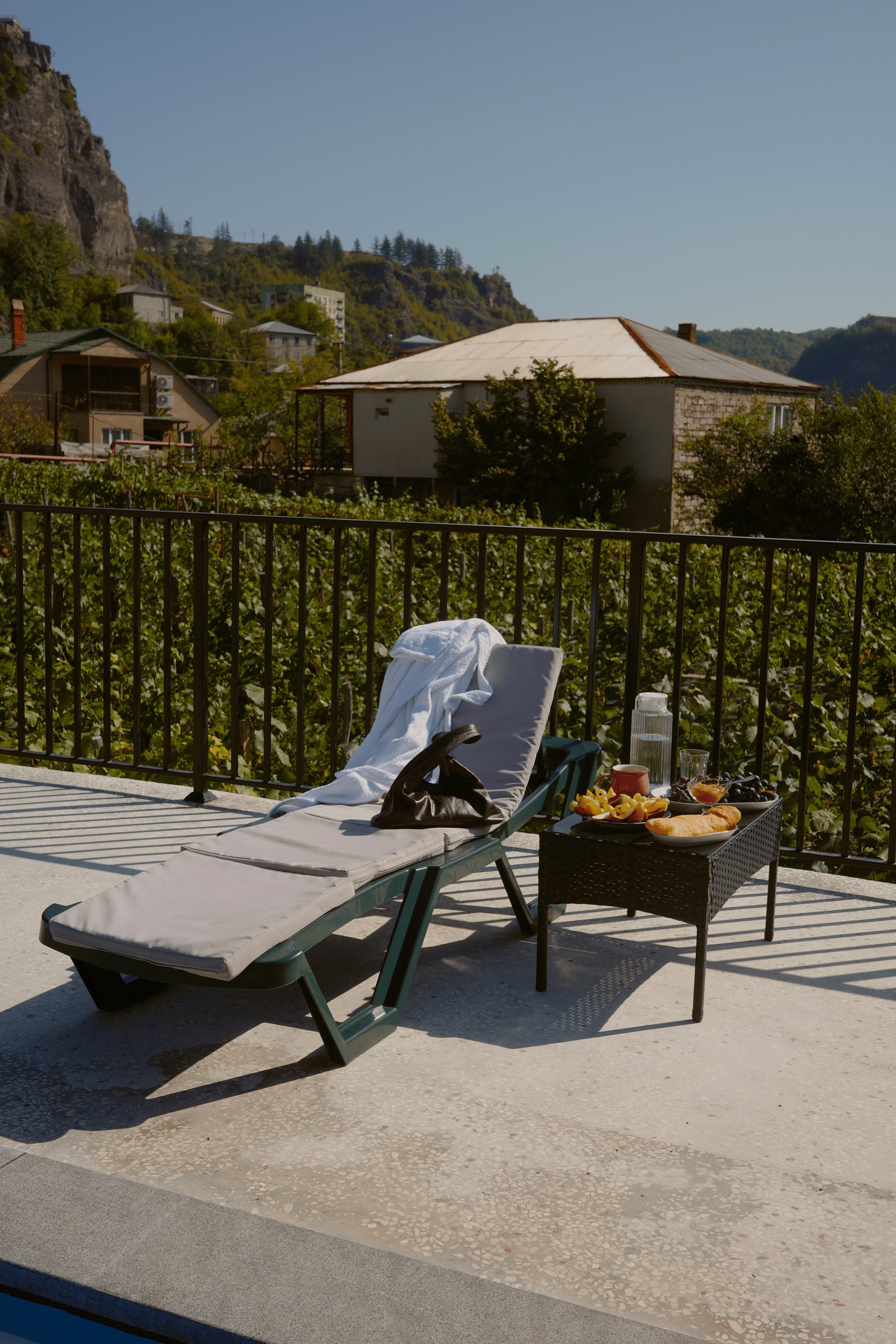 Terrace with lounge chairs and mountain views
