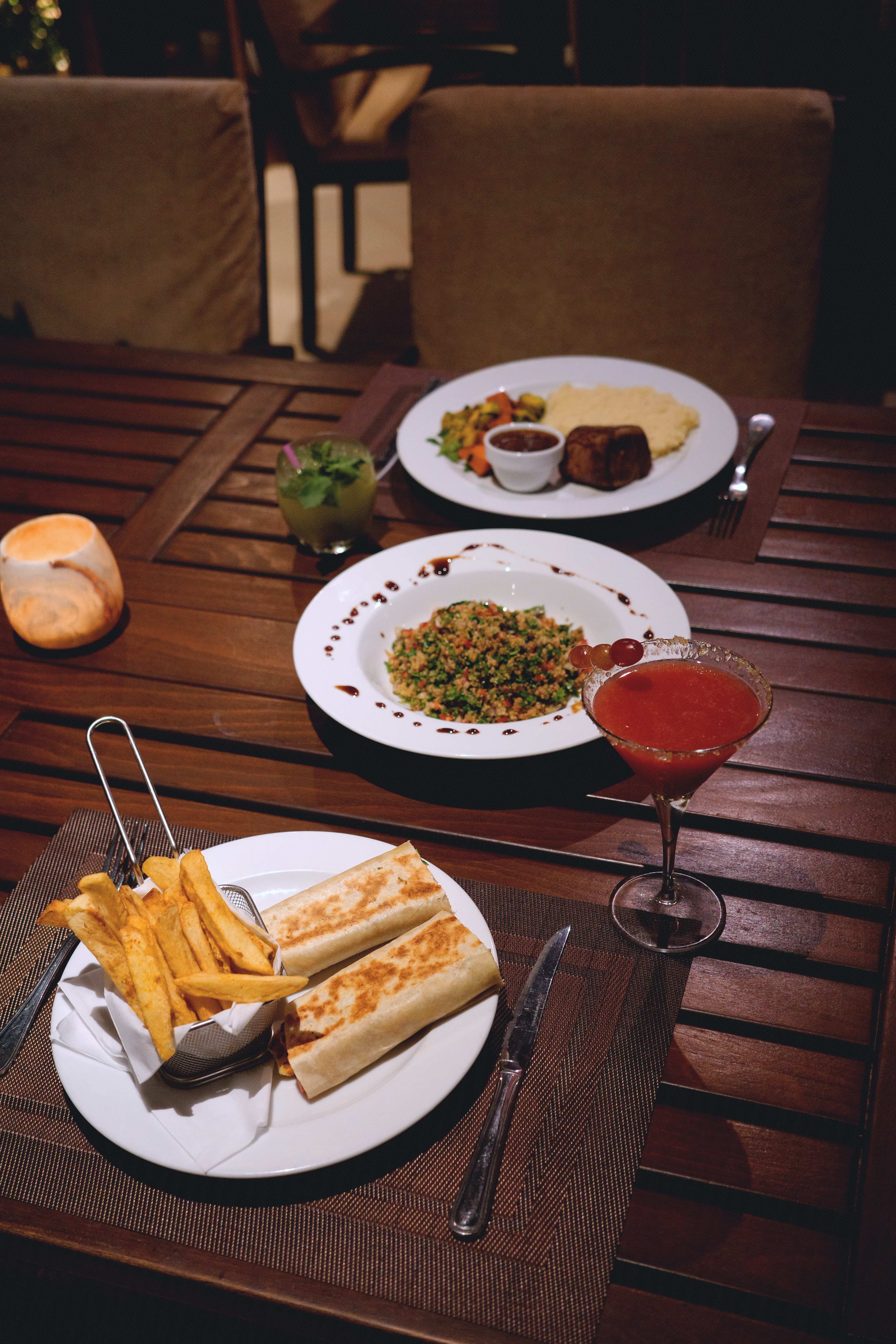 Evening dining spread with cocktails