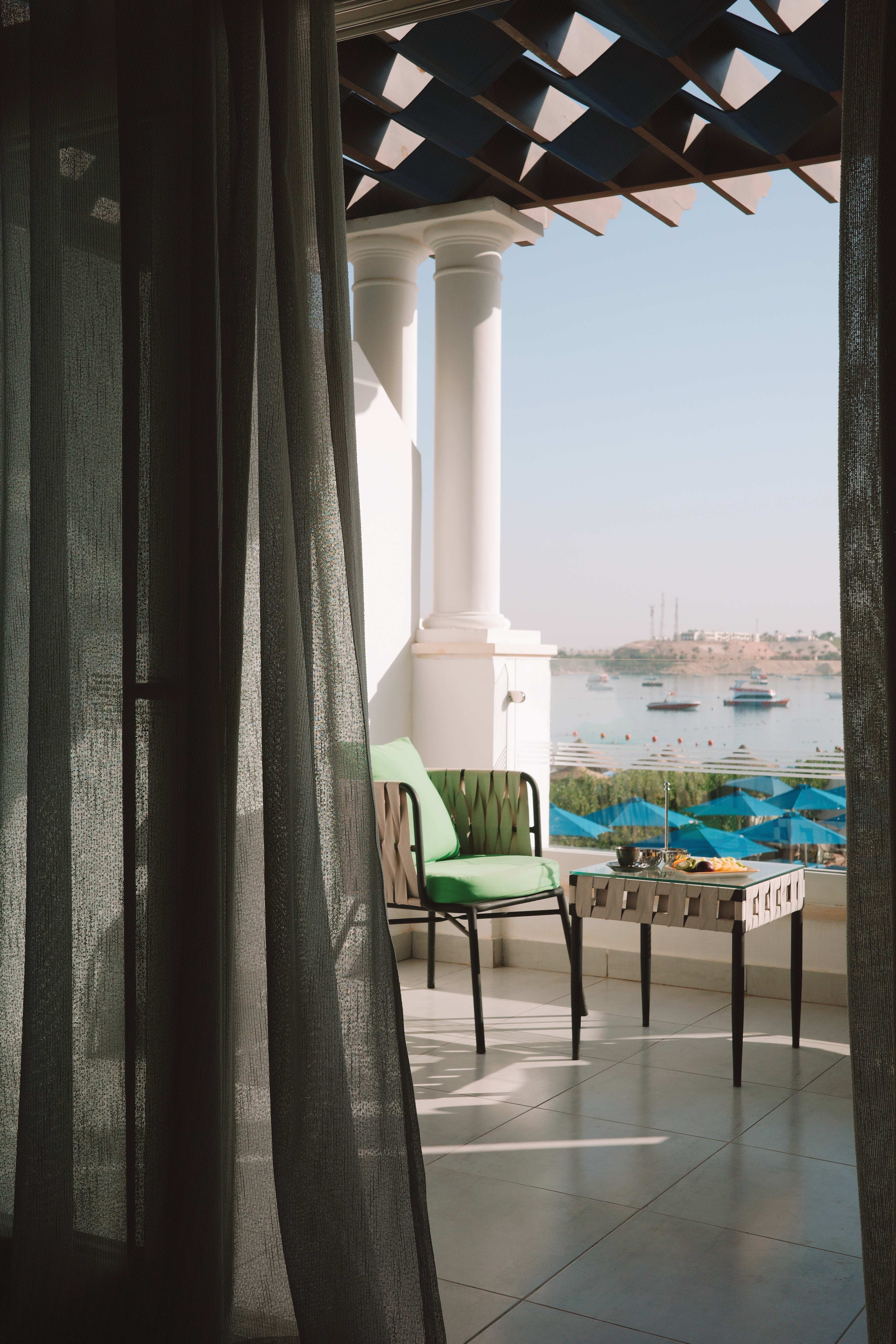 Suite balcony with morning coffee and sea view