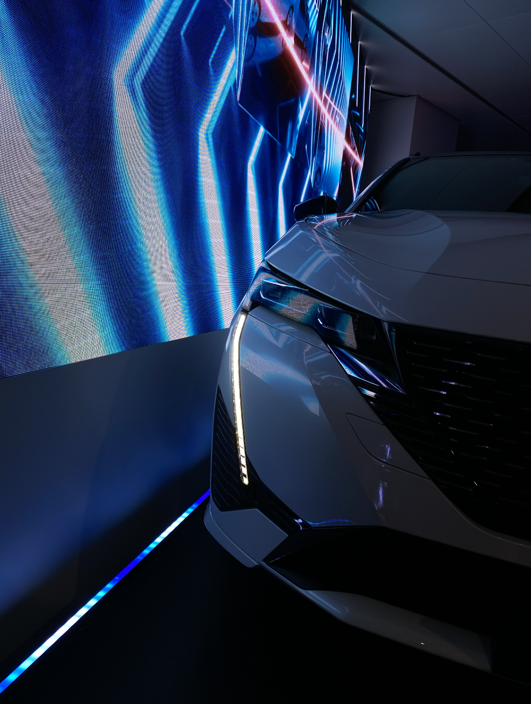 Peugeot vehicle with dramatic LED lighting in showroom
