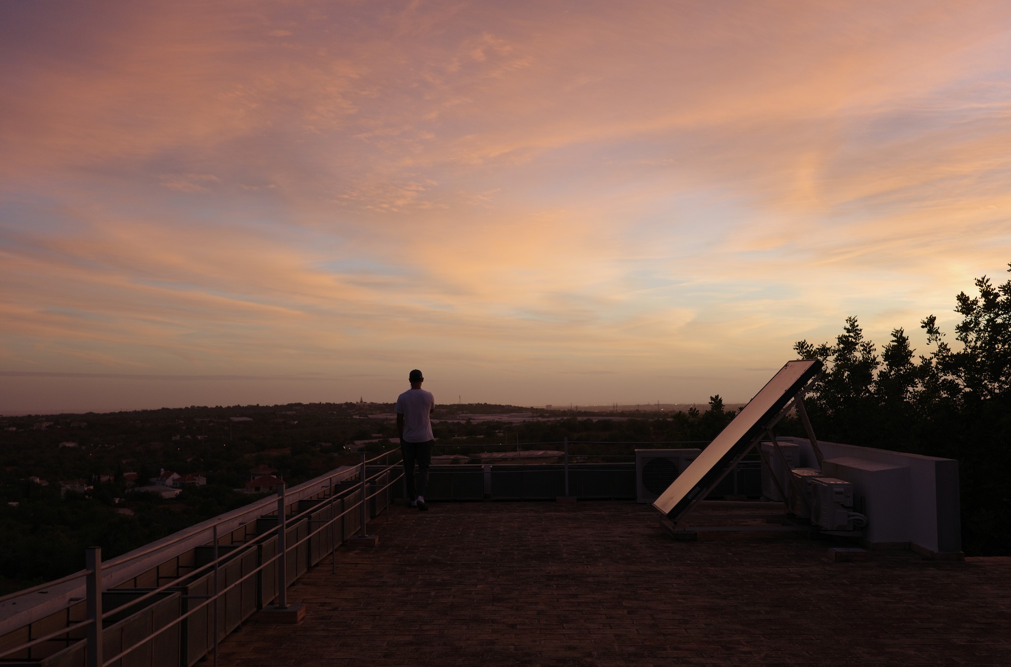 Rooftop terrace at sunset with panoramic views