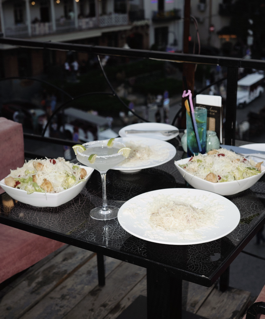 Dining table with margaritas and dishes