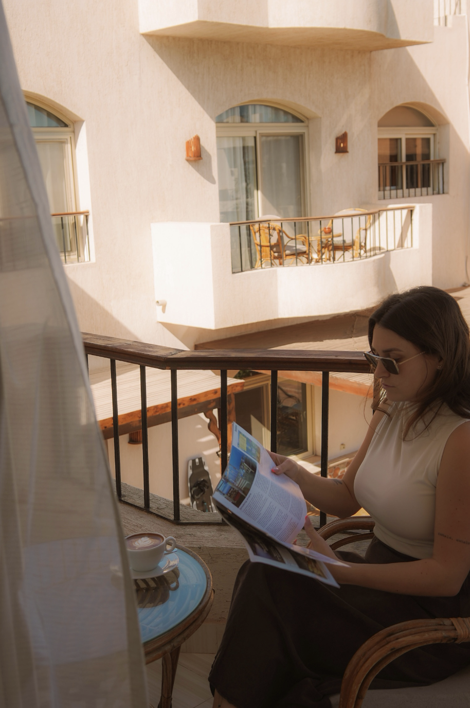 Guest reading on private balcony